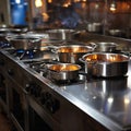 Cooking array Stainless steel pots on display atop the restaurant stove Royalty Free Stock Photo