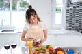 Cooking asian woman housewife in the kitchen making healthy food Royalty Free Stock Photo