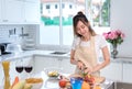 Cooking asian woman housewife in the kitchen making healthy food Royalty Free Stock Photo