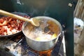 Cooking assorted seafood over a gas burner Royalty Free Stock Photo