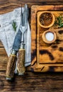 Cooking background concept. Vinrage cutting board with cutlery. Top view Royalty Free Stock Photo