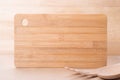 Cooking background. Cutting board and wooden spoon Royalty Free Stock Photo