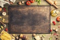 Cooking background: empty rustic baking sheet and italian ingredients. Royalty Free Stock Photo