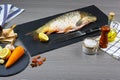 Cooking background, fish on the blackboard, top view. copy text menu