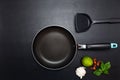 Cooking background Top view frying pan and pot on black leather table background Royalty Free Stock Photo