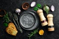 Cooking background. Vegetables, spices and kitchen utensils on a stone background. Royalty Free Stock Photo