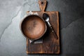 Cooking background. Vintage empty clay bowl on cutting boards, copy space Royalty Free Stock Photo