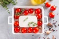 Cooking baked feta pasta. Raw ingredients before cooking: pasta, feta cheese, olive oil and cherry tomatoes, herbs and garlic. Top Royalty Free Stock Photo