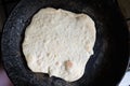 Cooking bannock on a pan