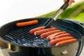 Meat sausages roasting on hot brazier grill Royalty Free Stock Photo