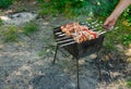 Cooking barbecue with vegetables on skewers. Roasted meat on the grill