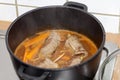 Cooking beef roulade in sauce. german beef rolls in pot. Royalty Free Stock Photo