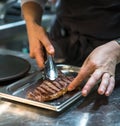 Cooking beef steak on a barbecue grill. Restaurant, chef. Open fire Coal.