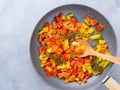 Cooking bell peppers with rosemary