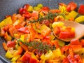 Cooking bell peppers with rosemary