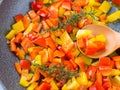 Cooking bell peppers with rosemary