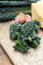 Cooking with black flat leaves of cavolo nero tuscan cabbage Royalty Free Stock Photo