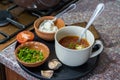 Cooking of borscht. A bowl with borscht on a table