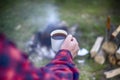 Cooking breakfast on a campfire at a summer camp. Royalty Free Stock Photo