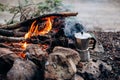 Cooking breakfast on a campfire at a summer camp. Royalty Free Stock Photo