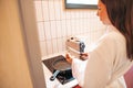 Cooking breakfast. Young woman preparing scrambled eggs Royalty Free Stock Photo