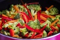 Cooking Broccoli With Thin Sliced Bell Peppers And Carrots