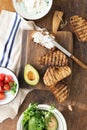 Cooking bruschetta. Feta cheese, cherry tomatoes and avocado. It Royalty Free Stock Photo