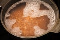 Cooking buckwheat without heat treatment in water in a cast iron cauldron