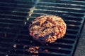 cooking burgers on hot grill with flames Royalty Free Stock Photo