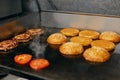 Cooking Burgers. Meat And Buns Roasting On Grill Royalty Free Stock Photo