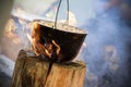 Cooking in cauldron on Finnish candle