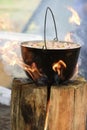 Cooking in cauldron on Finnish candle