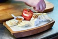 Cooking cheese plate with apple and walnut