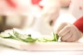 Chef Cutting cucumber on board Royalty Free Stock Photo