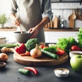 Cooking - chef\'s hands preparing vegetable vegetarian stew (thick soup). Kitchen scenery - pot with recipe