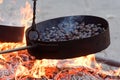 Cooking chestnuts on burning coals
