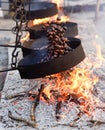 Cooking chestnuts on burning coals