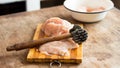 Cooking chicken chops with meat hammer Royalty Free Stock Photo