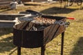 cooking chicken kebabs on a barbecue on a country plot, the concept of a weekend and a country holiday