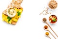 Cooking chickpeas. Bowl with hummus among pieces of crispbread and spices on white background top view copy space