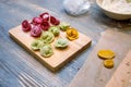 Cooking class, culinary. food and people concept, molding of colorful pelmeni or meat dumplings, national traditional food, Royalty Free Stock Photo