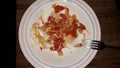 Cooking the classic Israeli food shakshuka from tomatoes and eggs