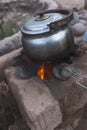 Cooking in a clay rocket kitchen in M'Hamid El Ghizlane