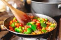 Cooking colorful and healthy vegetable mix in the pan