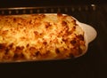 Cooking comfort food and traditional English cuisine, fish pie baking in the oven in countryside kitchen, homemade Royalty Free Stock Photo