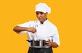 Cooking Concept. Smiling Black Chef Woman Stirring Food In Saucepan Royalty Free Stock Photo