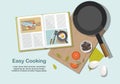 Cooking consept. Recipe book, frying pan and food. Top view.