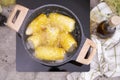 Cooking corn cob in a pot of boiling water with bubbles Royalty Free Stock Photo