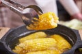 Cooking corn cob in a pot of boiling water with bubbles Royalty Free Stock Photo