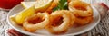 Cooking crispy calamari rings in golden oil for tender perfection and delicious flavor Royalty Free Stock Photo